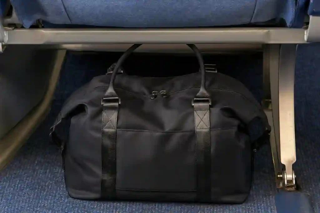 Classic black women’s tote bag with a spacious interior and simple, affordable design suitable for everyday use and travel.