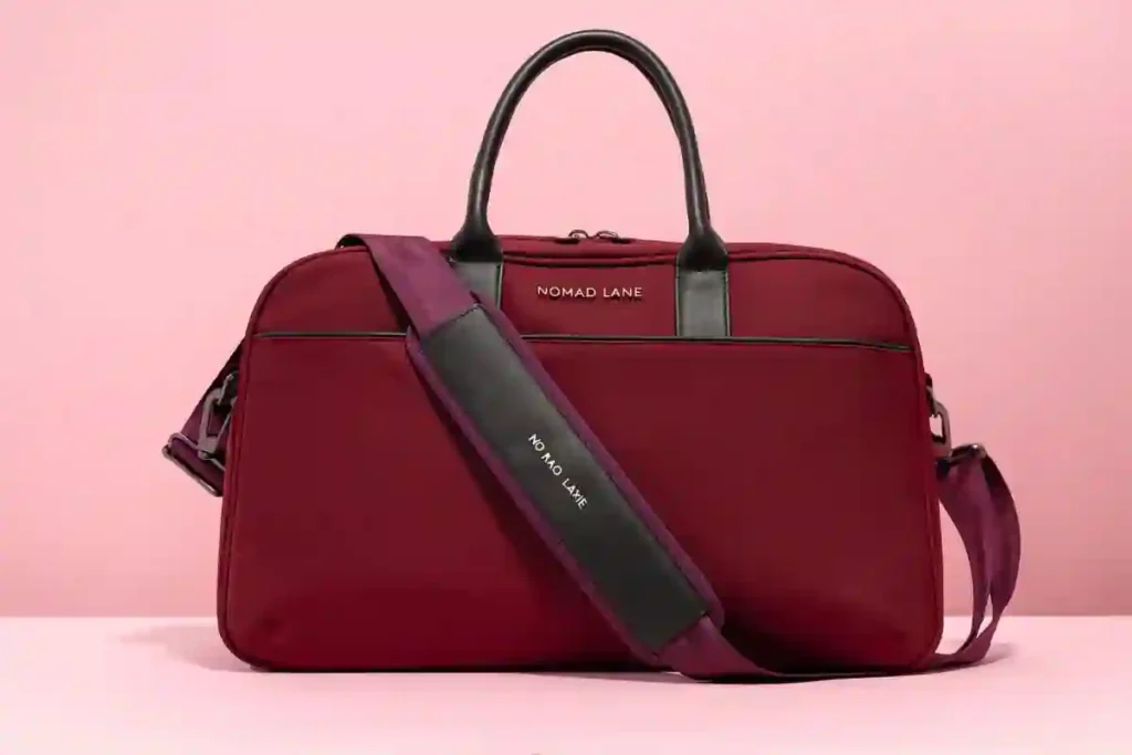 Nomad Lane Bento Bag fitting under an airplane seat with organized compartments -  Best Under-Seat Bags & Personal Item Size 