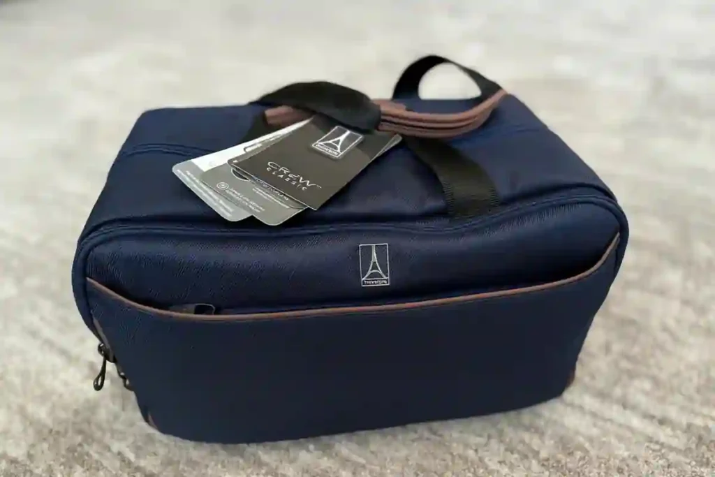 Travelpro Crew Classic Tote used as soft personal item bag under airplane seat