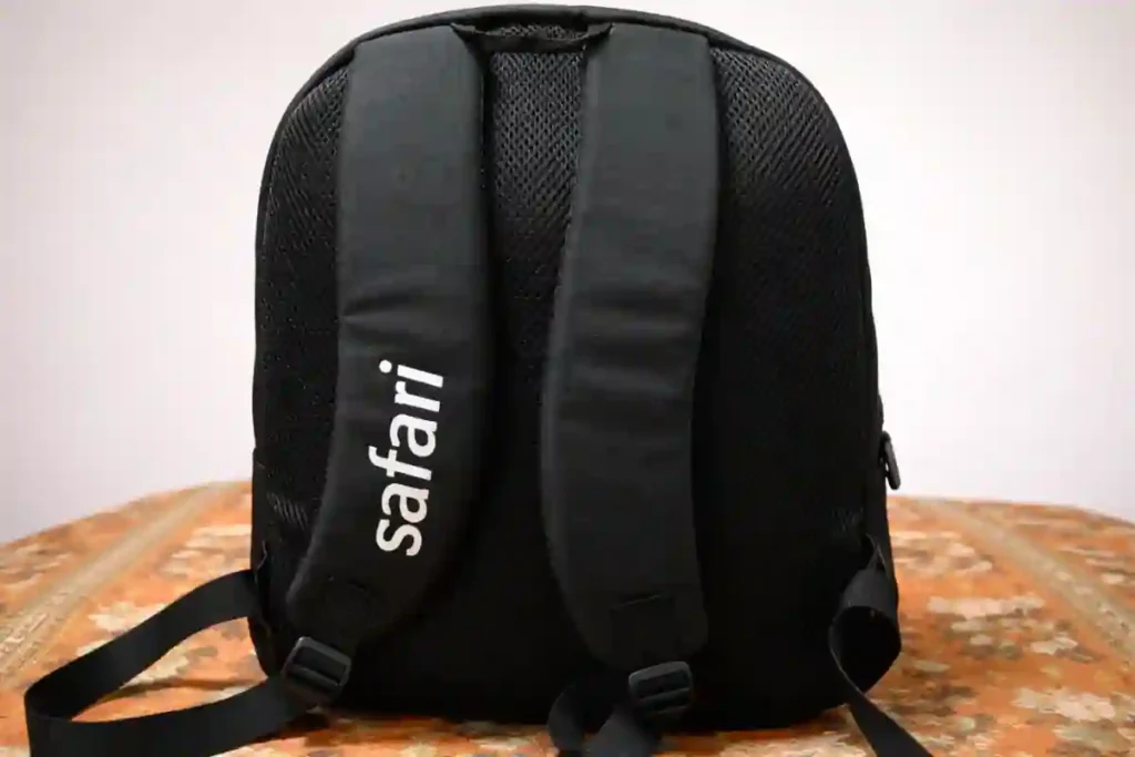 Safari Omega 35L backpack shoulder straps and compression straps showing weight balance and comfort during long daily commutes