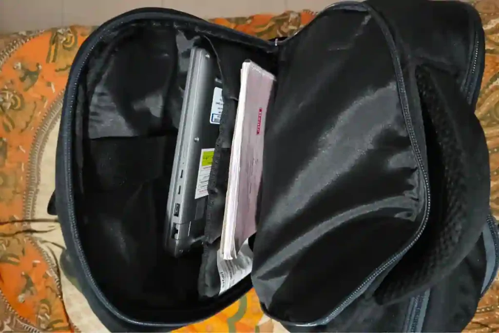 Safari Omega 35L laptop backpack fitting a 15.6-inch laptop securely inside padded compartment during real-world use